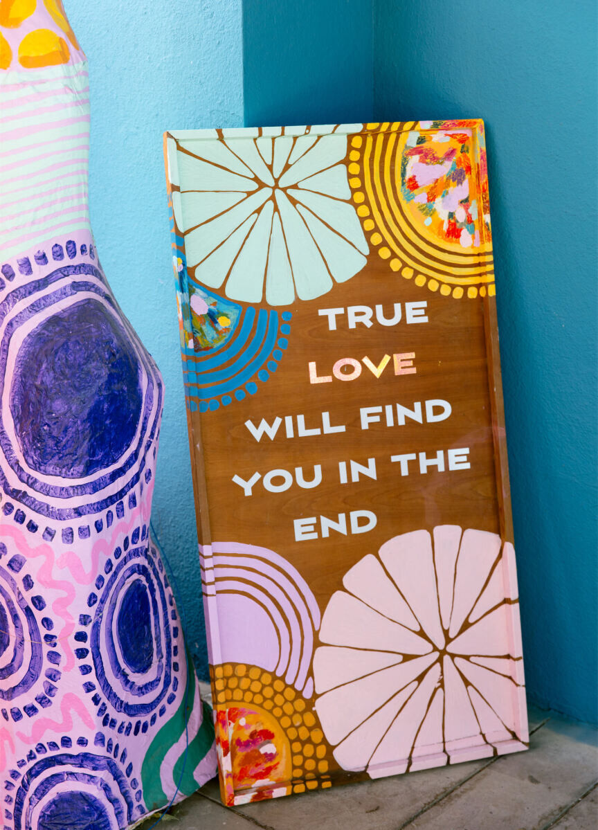 Painted signage was beautiful and meaningful and kept long after this vibrant, outdoor wedding day.