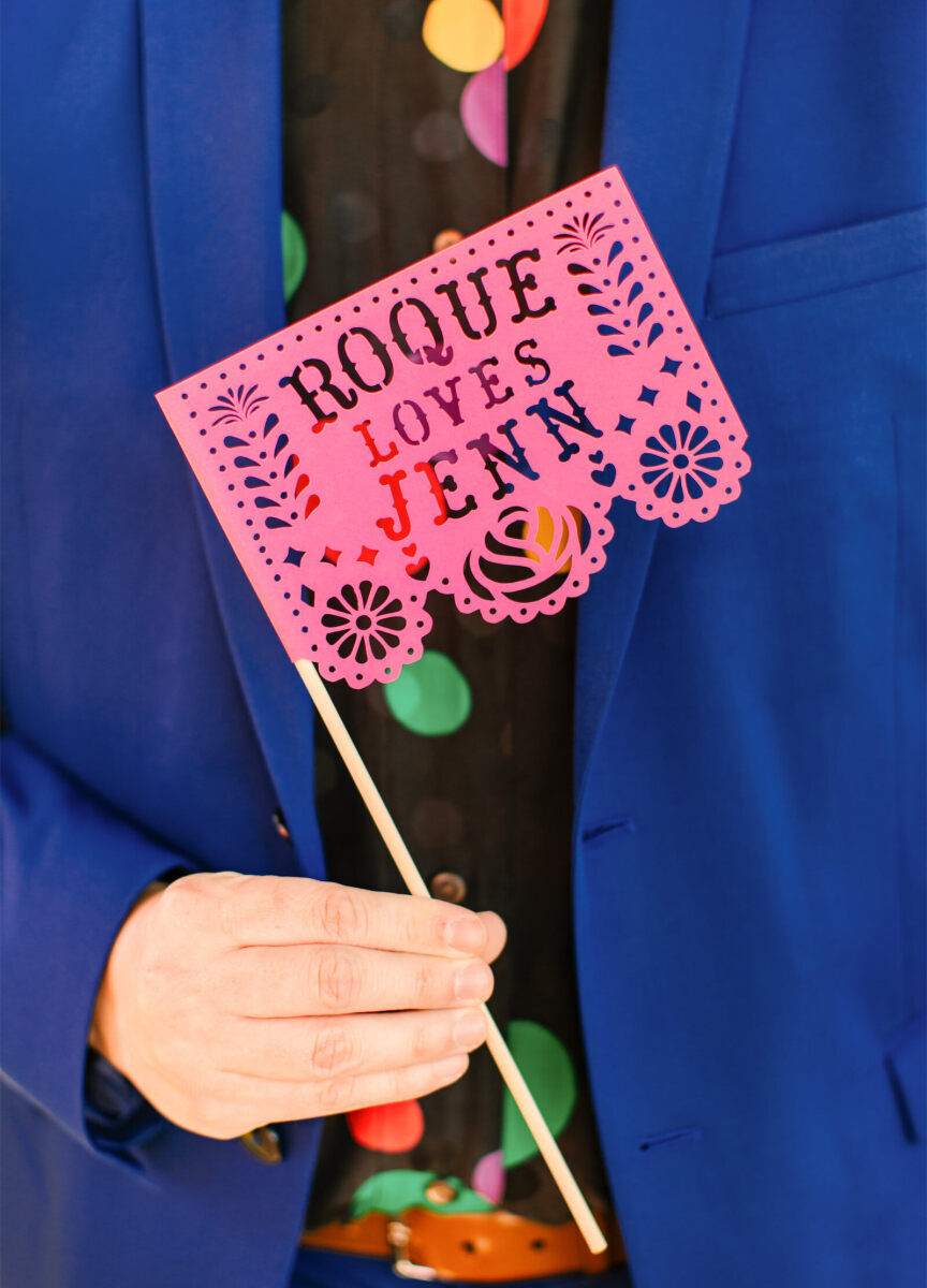 Papel picado flags were one way the couple honored the groom's Mexican heritage at their vibrant, outdoor wedding.